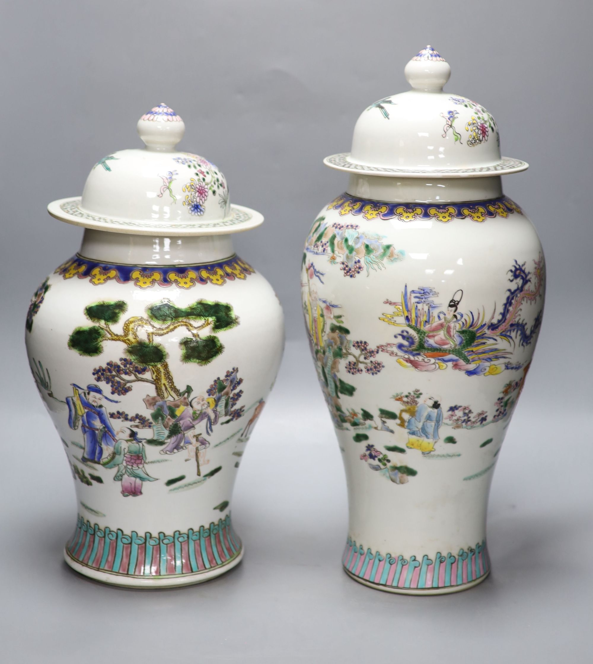 Two Chinese famille rose vases and covers, tallest 47cm